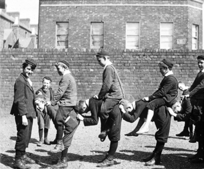 Boys playing a posed version of churchie